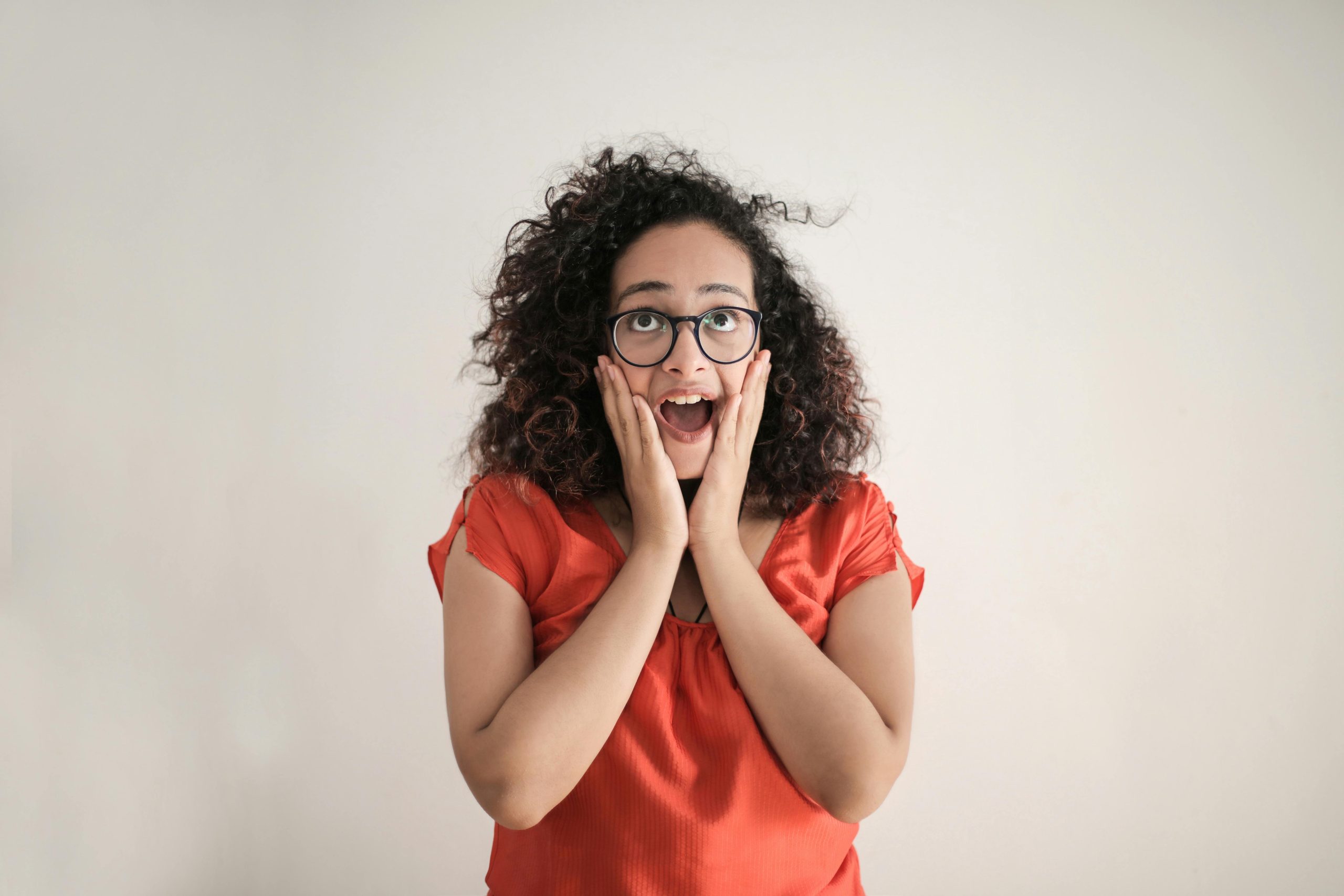 woman with shocked expression looking at the ceiling